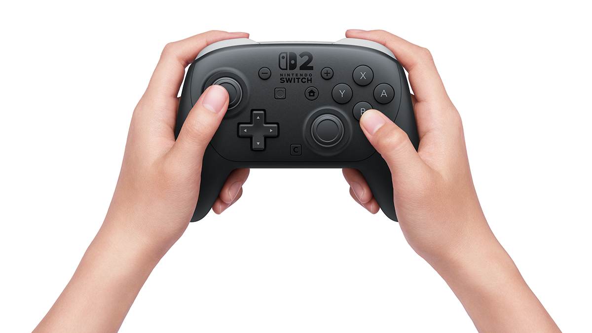 Two hands holding the black Switch 2 Pro Controller in Nintendo's product photo